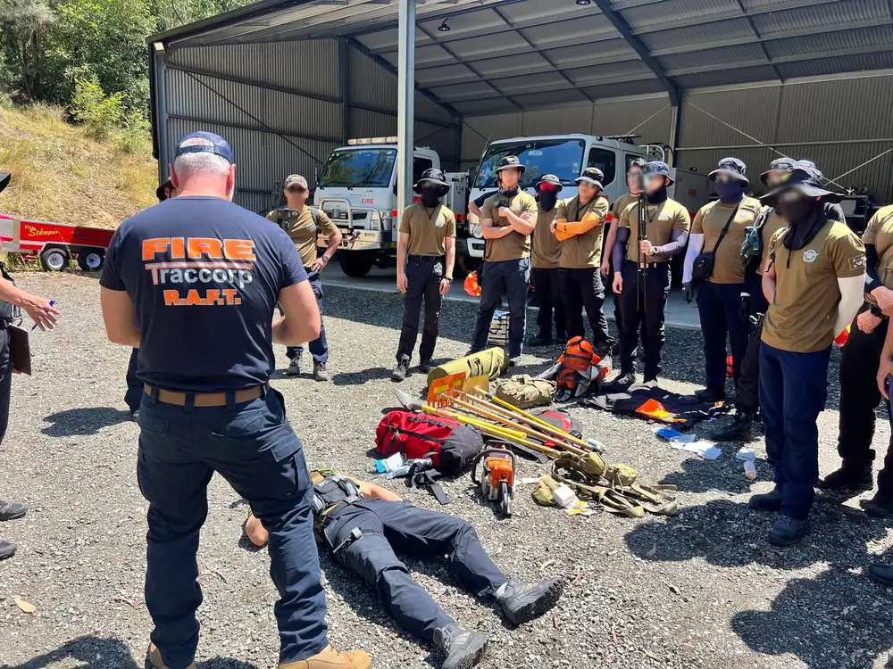 Instructor briefing participants before a field exercise.